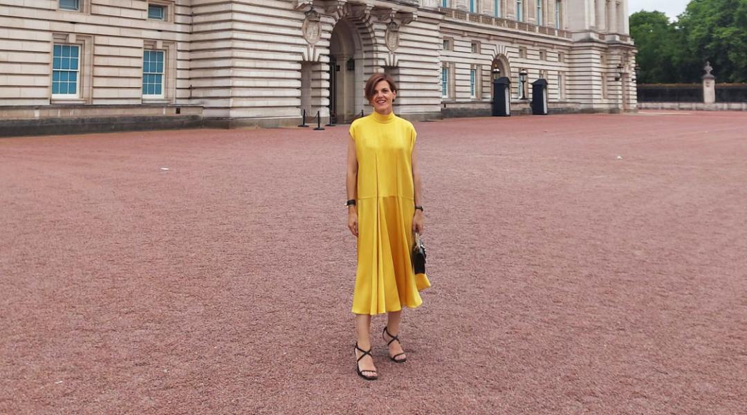 Amaia Arrieta, founder of Amaia Kids, poses in front of the entrance to Buckingham Palace