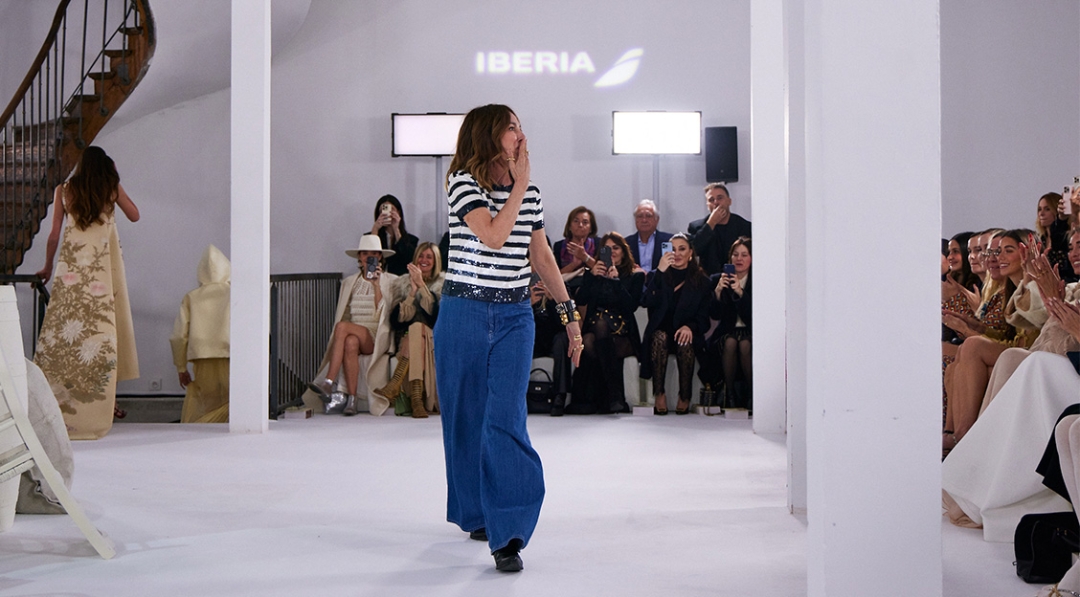 Teresa Helbig appreciates applauses at the closing of '1832 Sur Mer' fashion show in the French capital