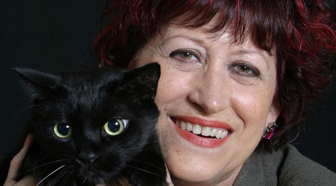 Pilar Aymerich, Spanish National Photography Award in 2021, poses alongside her cat