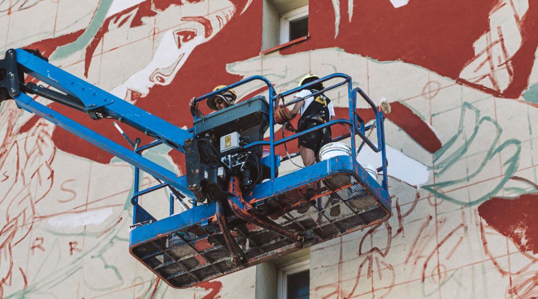 María López and Javier de Riba, members of Reskate Studio, on a crane in Grenoble (France)