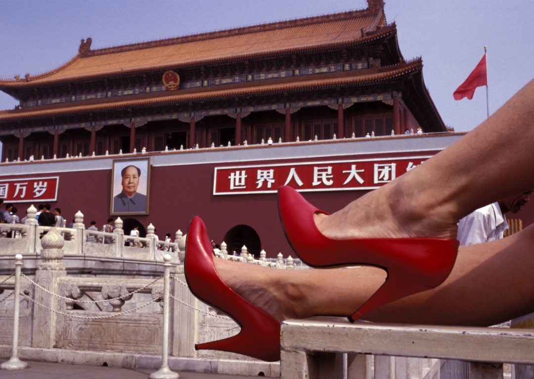 Red shoes, in this case at Tiananmen Square in Beijing, are one of Tino Soriano’s distinguishing traits